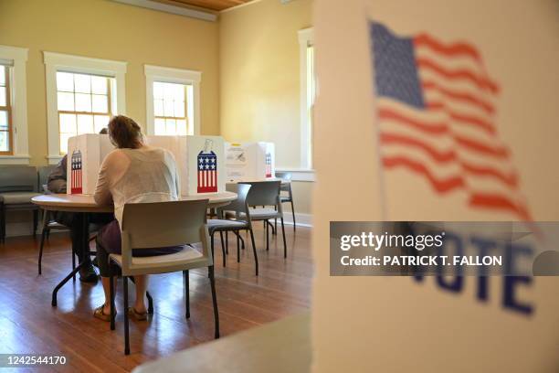 People cast their ballots in the Republican primary election at the Old Wilson Schoolhouse Community Center in Wilson, Wyoming, on August 16, 2022. -...