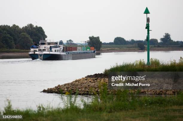 River cargo vessel is barely loaded as water levels in the Lek River are getting critically low on August 16, 2022 in Beusichem, Netherlands. The...