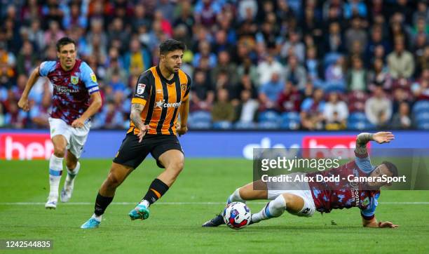 Burnley's Josh Brownhill battles with Hull City's Ozan Tufan during the Sky Bet Championship between Burnley and Hull City at Turf Moor on August 16,...