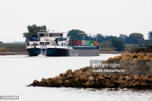 River cargo vessel is barely loaded as water levels in the Lek River are getting critically low on August 16, 2022 in Beusichem, Netherlands. The...