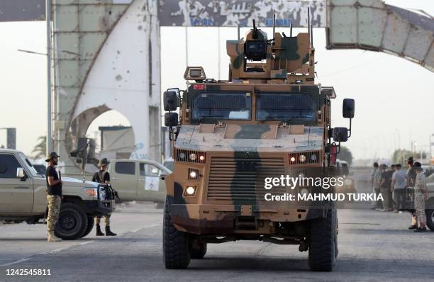 Joint forces affiliated with Libya's Government of National Unity, assemble inside the closed Tripoli International Airport as they deploy on the...