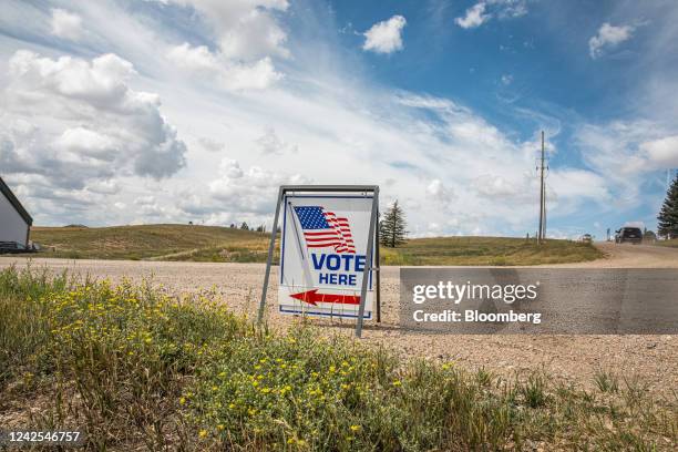 Vote Here" sign outside a polling location at North Christian Church in Cheyenne, Wyoming, US, on Tuesday, Aug. 16, 2022. Liz Cheney, who has held...