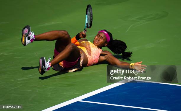 Coco Gauff of the United States rolls her ankle and takes a tumble while playing against Marie Bouzkova of the Czech Republic in her first round...