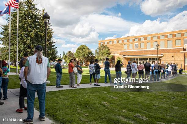 Voters wait in line to cast ballots outside a polling location at Storey Gym in Cheyenne, Wyoming, US, on Tuesday, Aug. 16, 2022. Liz Cheney, who has...