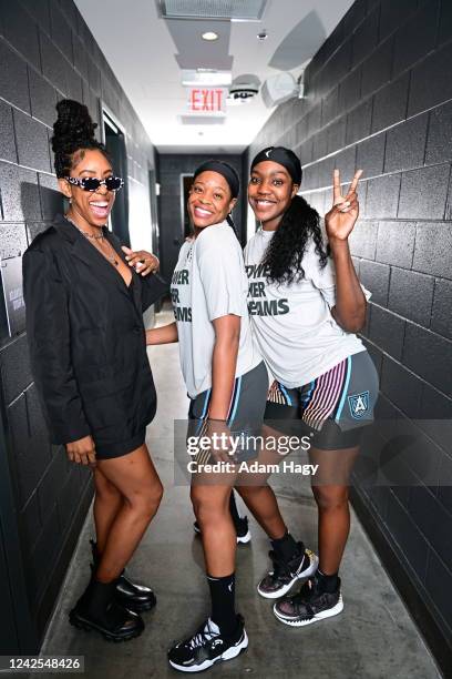 Monique Billings of the Atlanta Dream and Kia Vaughn, Beatrice Mompremier pose for a photo before the game against the New York Liberty on August 12,...