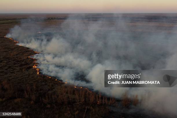 Aerial view showing wildfires raging through wetlands in islands in the Parana Delta near Victoria, in the Argentine province of Entre Rios, in front...