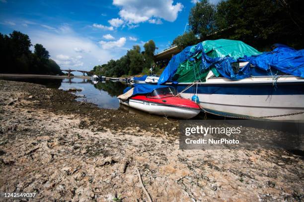 A boat is seen resting on on partically dried up river bank of ohbach rivver which direct connect to Rhine river during the low water level of Rhine...