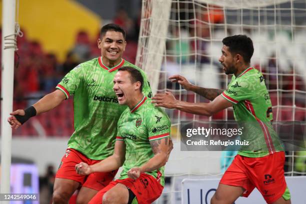 Jesús Dueñas of FC Juarez celebrates with teammates after scoring his team's first goal during the 9th round match between Atlas and FC Juarez as...