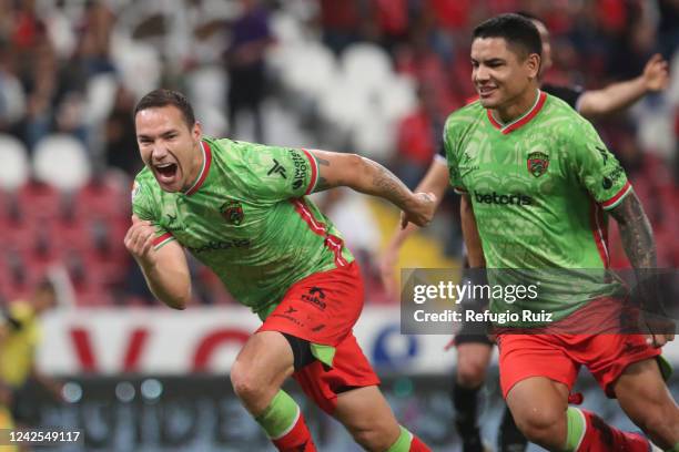 Jesús Dueñas of FC Juarez celebrates with teammates after scoring his team's first goal during the 9th round match between Atlas and FC Juarez as...