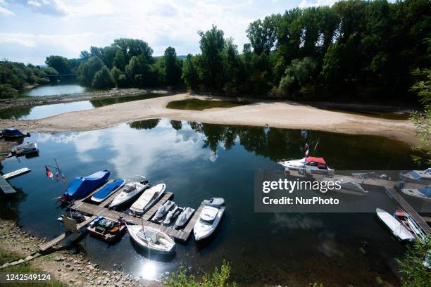 Sevearl boats are seen resting on on dried up partically river bank of ohbach rivver which direct connect to Rhine river during the low water level...