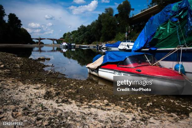 A boat is seen resting on on partically dried up river bank of ohbach rivver which direct connect to Rhine river during the low water level of Rhine...