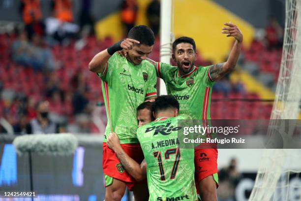 Jesús Dueñas of FC Juarez celebrates with teammates after scoring his team's first goal during the 9th round match between Atlas and FC Juarez as...