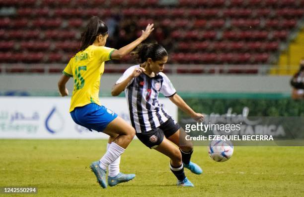 Brazil's Ravena vies for the ball with Costa Rica's Paula Arce during the Women's U-20 World Cup football match between Costa Rica and Brazil at the...