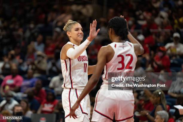 Washington Mystics forward Elena Delle Donne high fives guard Shatori Walker-Kimbrough during the game at the Entertainment and Sports Arena in...