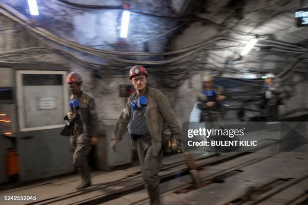 Miners emerge from the mine called Heroes of the Cosmos in Pavlograd city, in the Donbas region, east Ukraine, on August 15, 2022. Deep beneath the...