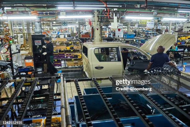 The cab of a Hilux vehicle moves along the automobile production line at the Toyota Motor Corp. Manufacturing plant in Durban, South Africa, on...
