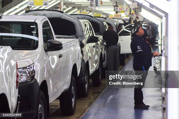 Newly-assembled Hilux automobiles pass through quality control at the Toyota Motor Corp. Manufacturing plant in Durban, South Africa, on Tuesday,...