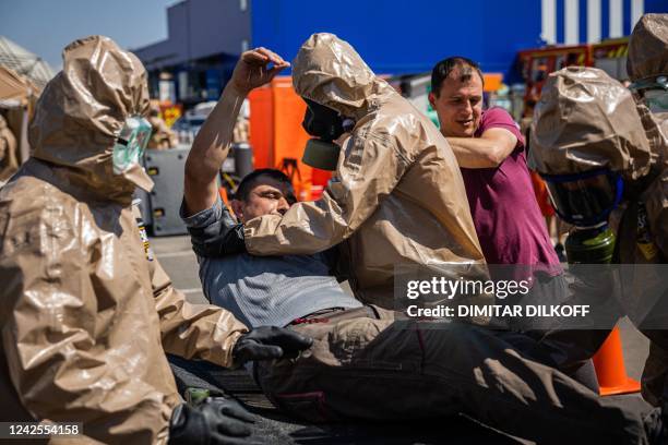 Ukrainian Emergency Ministry rescuers attend an exercise in the city of Zaporizhzhia on August 17 in case of a possible nuclear incident at the...