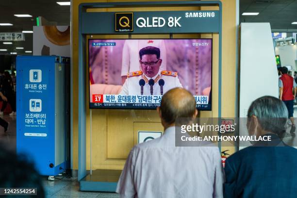 People sit near a screen showing a news broadcast at a train station in Seoul of North KoreaÕs leader Kim Jong Un, at a railway station in Seoul on...