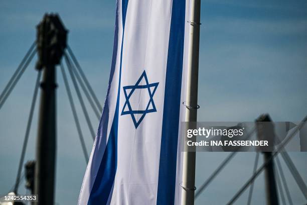 An Israeli flag is seen on August 17, 2022 at the Olympic park in Munich, southern Germany, as 50 years ago, on September 5 and 6, 1972 were killed...