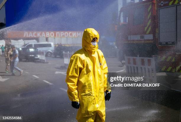 Ukrainian Emergency Ministry rescuer attends an exercise in the city of Zaporizhzhia on August 17 in case of a possible nuclear incident at the...