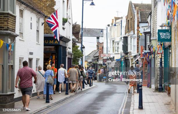 Shoppers pass along the main high street in Whitstable, UK, on Tuesday, Aug 16, 2022. Inflation, which is at a 40-year high and set to accelerate,...
