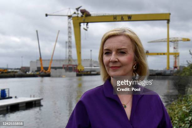 British Foreign Secretary and Conservative leadership candidate Liz Truss stands next to the Pioneer foil boat that is used to transport crew in...