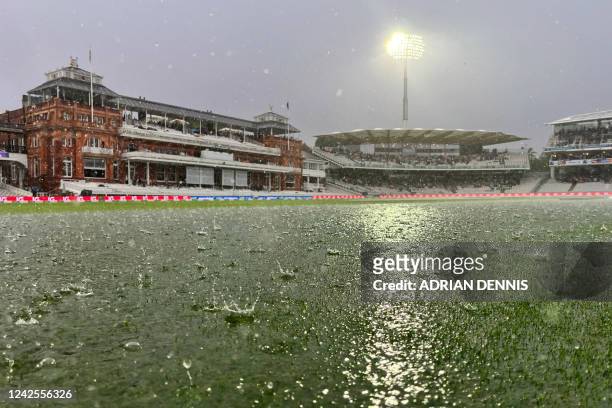 Rain stops play on the opening day of the first Test match between England and South Africa at the Lord's cricket ground in London on August 17,...