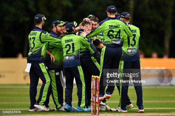 Belfast , United Kingdom - 17 August 2022; Josh Little of Ireland celebrates with teammates after claiming the wicket of Mohammad Nabi of Afghanistan...