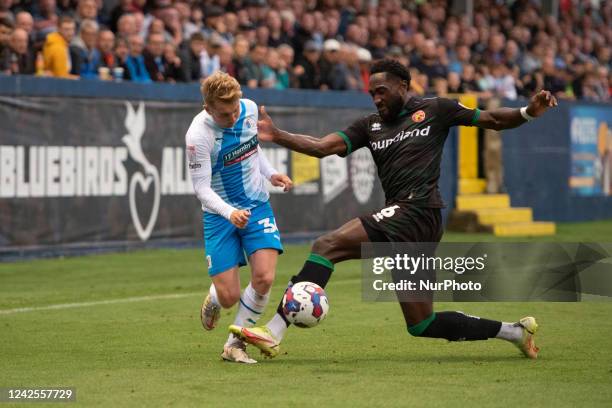 Barrow's Ben Whitfield battles for possession with Emmanuel Monthe of Walsall during the Sky Bet League 2 match between Barrow and Walsall at the...