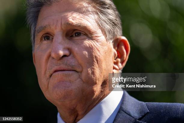 Sen. Joe Manchin speaks to members of the press following the signing of H.R. 5376, the Inflation Reduction Act of 2022, into law in the State Dining...