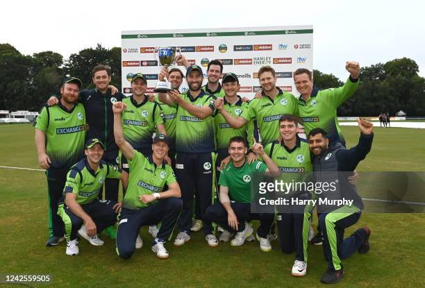 Belfast , United Kingdom - 17 August 2022; Ireland captain Andrew Balbirnie lifts the trophy with teammates after the Men's T20 International match...