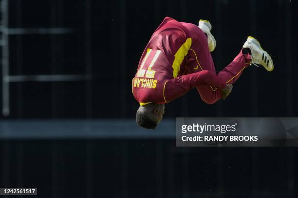 Kevin Sinclair of West Indies celebrates the dismissal of Tom Latham of New Zealand during the 1st ODI match between West Indies and New Zealand at...