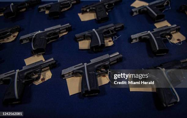 View of several semi-automatic weapons on display Wednesday, Aug. 17 in Miami, where federal agents announced a crackdown on weapons smuggling to...