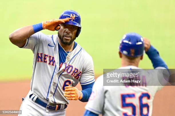 Starling Marte of the New York Mets salutes Joey Cora of the New York Mets after hitting a home run during the first inning against the Atlanta...