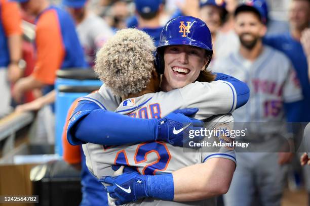 Brett Baty of the New York Mets hugs Francisco Lindor of the New York Mets after hitting his first home run during his first MLB at bat against the...