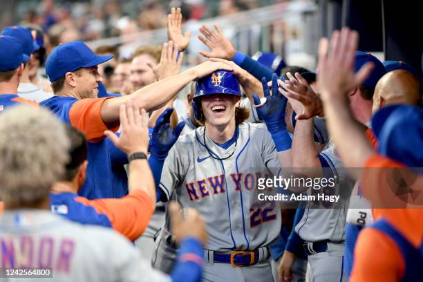 Brett Baty of the New York Mets celebrates with teammates after hitting his first home run during his first MLB at bat against the Atlanta Braves in...