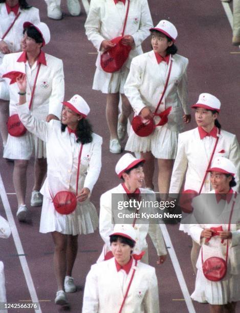 File photo taken July 25 shows Japanese athletes wearing uniforms designed by Hanae Mori during the opening ceremony of the Barcelona Olympics. Mori...