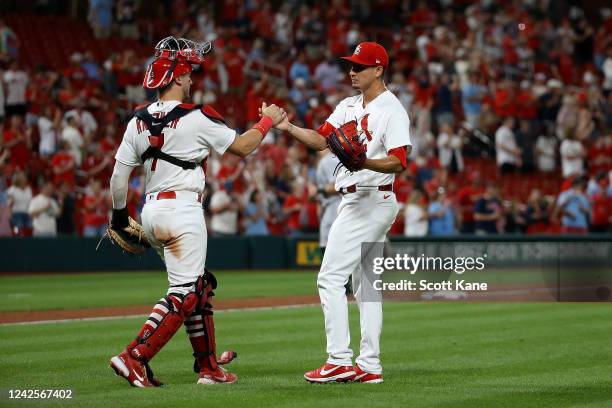 Andrew Knizner and Giovanny Gallegos of the St. Louis Cardinals congratulate each other after the teams victory against the Colorado Rockies at Busch...