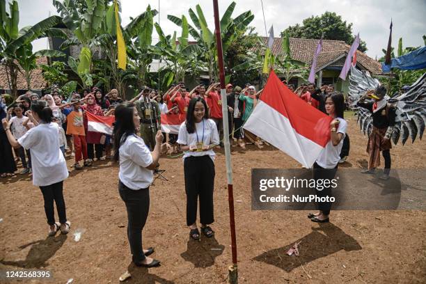 Residents take part in a ceremony to mark the 77th Indonesian Independence Day in Bogor, West Java, Indonesia, on August 17, 2022.