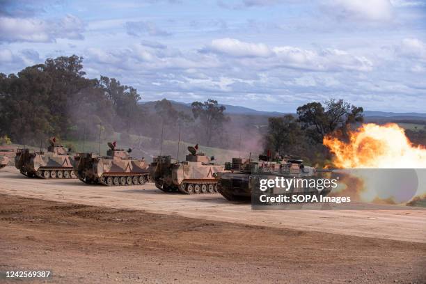 An Abrams tank and armoured personnel carrier fire during an army firepower demonstration for guests and families at Puckapunyal Range in Victoria....