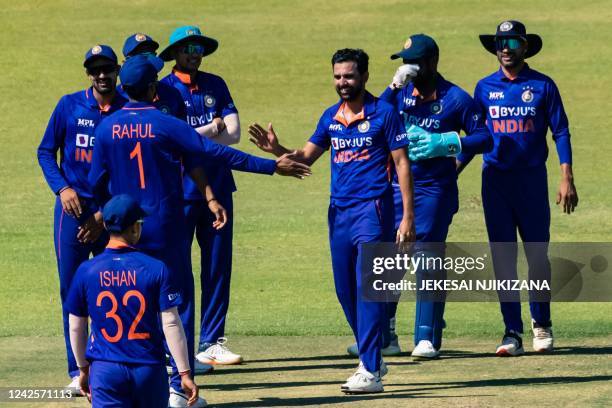 India's Deepak Chahar celebrates with teammates after the dismissal of Zimbabwe's Wessly Madhevere during the first one-day international cricket...