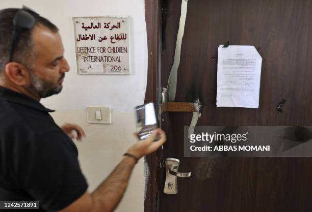 Picture shows the closed door of Palestinian NGO Defence for Children International after it was raided by Israeli forces in the West Bank city of...