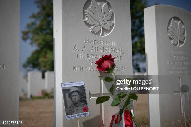 This photograph taken on August 18, 2022 shows a rose is posed on a grave of a soldier at the Dieppe Canadian War Cemetery, during the commemoration...