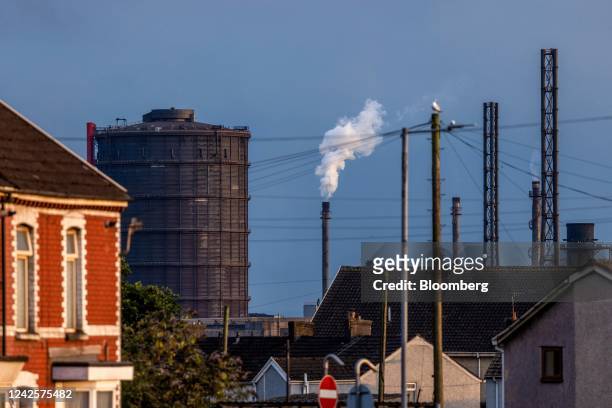 The steel works operated by Tata Steel Ltd. Beyond residential houses in Port Talbot, UK, on Wednesday, Aug. 17, 2022. Europe's heavy industry is...