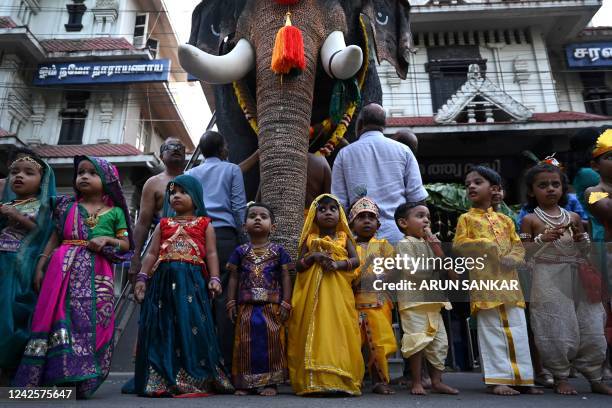 Children dress in the guise of Hindu deity Krishna gesture during 'Janmashtami' festival celebrations in Chennai on August 18, 2022.