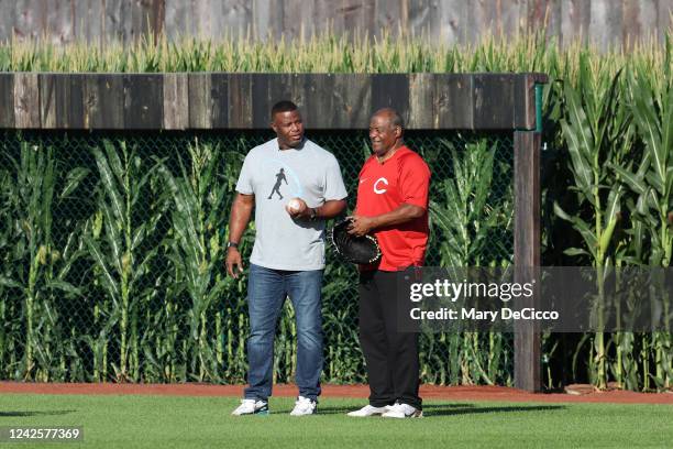 Baseball Hall of Famer and former Cincinnati Red Ken Griffey Jr. And his father and former Cincinnati Red Ken Griffey Sr. Walk out of the corn onto...