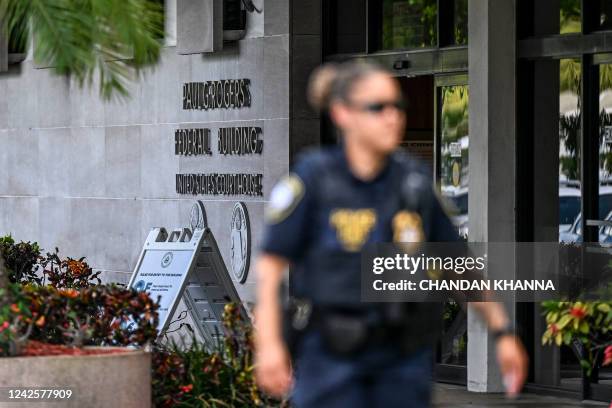 Security officers guard the entrance to the Paul G. Rogers Federal Building & Courthouse as the court holds a hearing to determine if the affidavit...