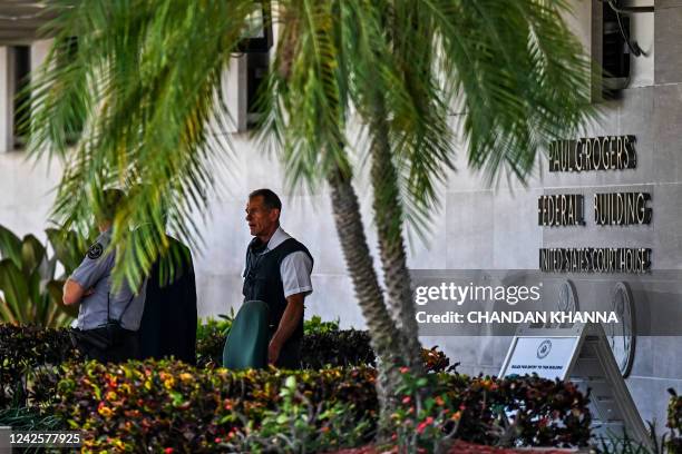 Security officers guard the entrance to the Paul G. Rogers Federal Building & Courthouse as the court holds a hearing to determine if the affidavit...