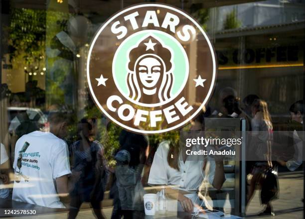 The Stars Coffee logo is seen on a window after former Starbucks coffee shops are reopened as Stars Coffee in Moscow, Russia on August 18, 2022. The...